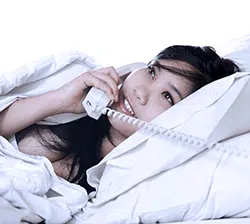 phone-in-bed Pretty girl in bed, on the phone